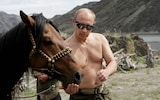 Vladimir Putin pictured with a horse while on holiday in Kyzyl, 2009