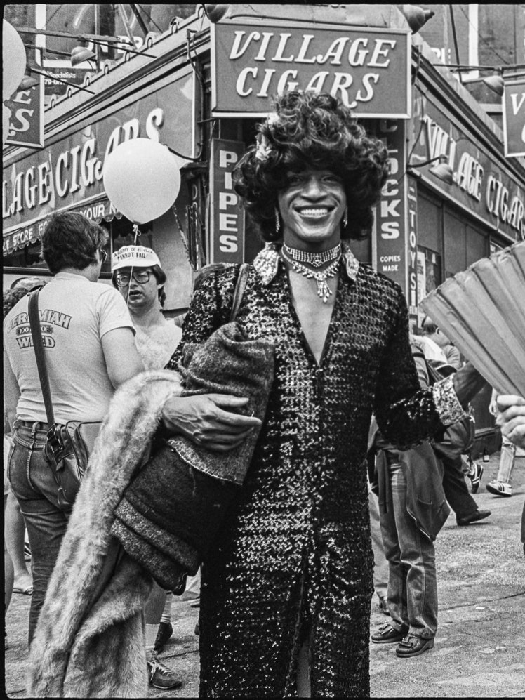 Portrait of American activist Marsha P Johnson   along with unidentified others on the corner of Christopher Street and...