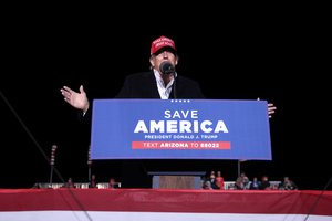 File - Former President of the United States Donald Trump speaking with supporters at a "Save America" rally at Country Thunder Arizona in Florence, Arizona.