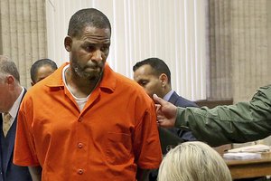 File - R. Kelly turns to exit during a hearing at the Leighton Criminal Court building, in Chicago, Sept. 17, 2019.