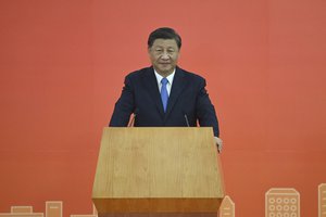 China's President Xi Jinping delivers a speech after arriving for the upcoming handover anniversary by train in Hong Kong, Thursday, June 30, 2022