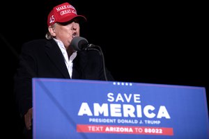 File - Former President of the United States Donald Trump speaking with supporters at a "Save America" rally at Country Thunder Arizona in Florence, Arizona.