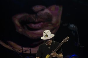 Mexican-born US guitarist Carlos Santana performs during a concert in Tel Aviv, Israel, Saturday, July 30, 2016.