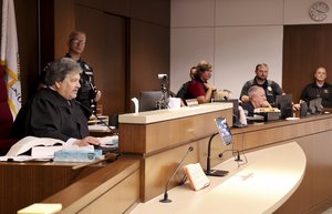 Lake County Judge Theodore Potkonjak, left, presides over the initial appearance of Robert E. Crimo III at the county courthouse Wednesday, July 6, 2022, in Waukegan, Ill.