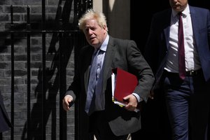 British Prime Minister Boris Johnson leaves 10 Downing Street, in London, to attend the weekly Prime Minister's Questions at the Houses of Parliament, Wednesday, June 15, 2022