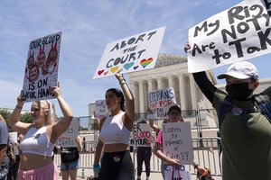 Abortion-rights activists protest outside the Supreme Court in Washington, Monday, July 4, 2022