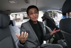 Rappler CEO and Executive Editor Maria Ressa gestures as she talks to reporters at the Court of Tax Appeals in metropolitan Manila, Philippines on Wednesday, April 3, 2019.