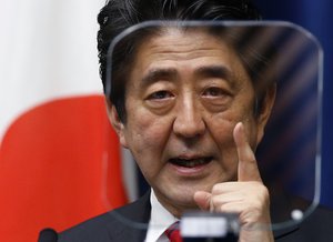 File - Japanese Prime Minister Shinzo Abe speaks during a press conference at his official residence in Tokyo on March 20, 2014. Former Japanese Prime Minister Abe, a divisive arch-conservative and one of his nation's most powerful and influential figures, has died after being shot during a campaign speech Friday, July 8, 2022, in western Japan