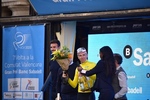 Tadej Pogacar on the podium after winning Volta a la Comunitat Valenciana