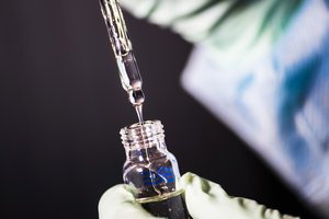 Captured inside a Centers for Disease Control and Prevention (CDC) laboratory, this image depicted a close view of a laboratory technician in the process of pipetting a sample of vitamin E acetate, which would be used in various tests conducted upon a number of electronic cigarettes, referred to as e-cigarettes, or e-cigs, and vaping pens, January 16, 2020.