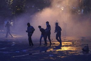 Police fires tear gas shells to disperse protesting students in Colombo, Sri Lanka, Friday, July 8, 2022