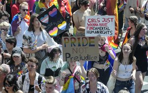 Participants of the Cologne Pride rally march through the city center in Cologne, Germany, Sunday, July 3, 2022. This year's Christopher Street Day (CSD) Gay Parade with thousands of demonstrators for LGBTQ rights is the first after the coronavirus pandemic to be followed by hundreds of thousands of spectators in the streets of Cologne.