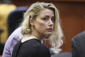 Actor Amber Heard waits before the verdict was read at the Fairfax County Circuit Courthouse in Fairfax, Va, Wednesday, June 1, 2022