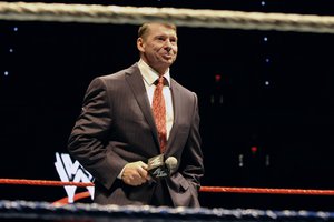 In this Oct. 30, 2010 file photo, WWE chairman and CEO Vince McMahon speaks to an audience during a WWE fan appreciation event in Hartford, Conn. WWE's 'Raw' set out to be a special kind of wrestling show from its birth on Jan. 11, 1993.