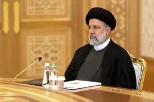 In this handout photo released by the Kremlin Press Service, Iran's President Ebrahim Raisi attends the summit of Caspian Sea littoral states in Ashgabat, Turkmenistan, Wednesday, June 29, 2022