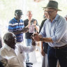 Prime Minister Anthony Albanese shakes hands with Yothu Yindi Foundation chair Galarrwuy Yunupingu after speaking at the Garma Festival on Saturday.