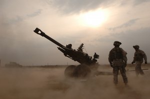  US Army (USA) Soldiers assigned to Alpha Company, 3rd Battalion, 6th Field Artillery train on firing points with a 105 mm M119 Howitzer outside Camp Liberty, Iraq, during Operation IRAQI FREEDOM. (SUBSTANDARD) (Released to Public)          wnhires  (js1)