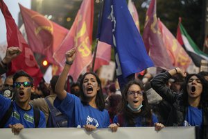 Students shout slogans against Brazil's President Jair Bolsonaro during a protest in defense of democracy, in Sao Paulo, Brazil, Thursday, Aug. 11, 2022