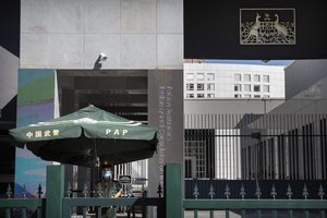 A Chinese paramilitary policeman stands guard at the Australian Embassy in Beijing, Tuesday, Sept. 1, 2020. Australia's government says a Chinese-born Australian journalist for CGTN, the English-language channel of China Central Television, has been detained in China.