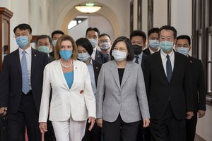 In this photo released by the Taiwan Presidential Office, U.S. House Speaker Nancy Pelosi, left, and Taiwanese President President Tsai Ing-wen arrive for a meeting in Taipei, Taiwan, Wednesday, Aug. 3, 2022