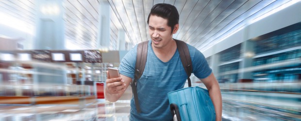 Young asian tourist rushing to boarding a plane on the departure area