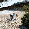 Locals surfing at Byron Bay.