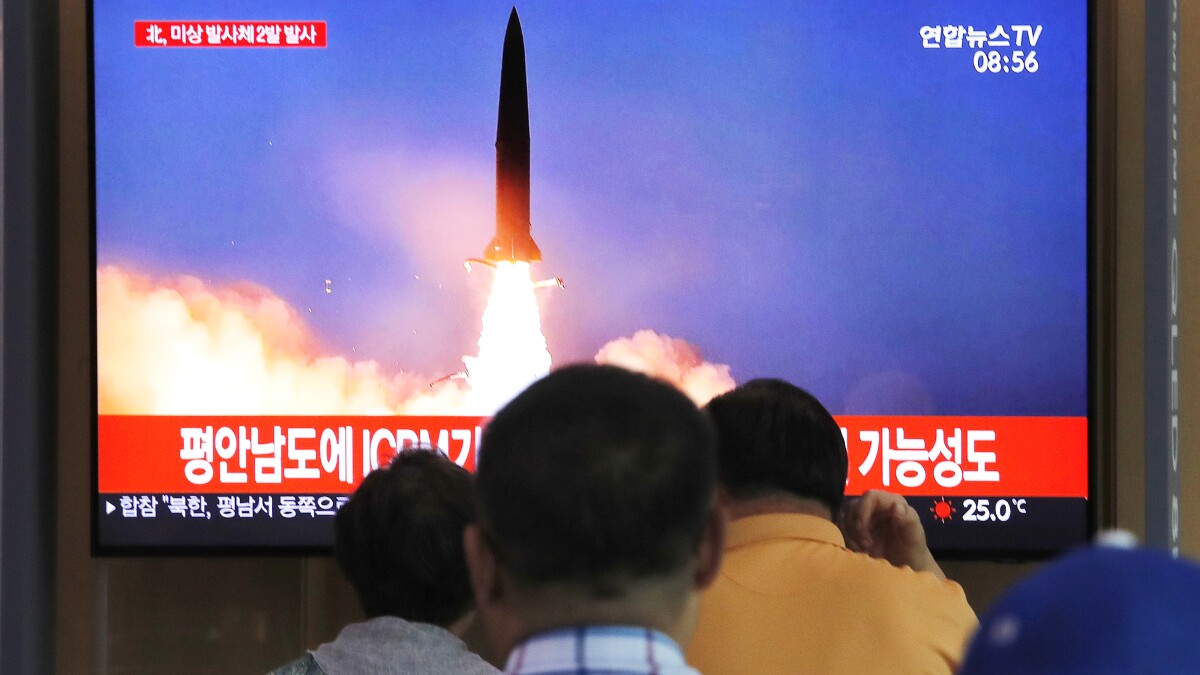 People watch a TV showing a file image of a North Korea's missile launch during a news program at the Seoul Railway Station in Seoul, South Korea, Tuesday, Sept. 10, 2019. North Korea launched at least two unidentified projectiles toward the sea on Tuesday, South Korea's military said, hours after the North offered to resume nuclear diplomacy with the United States but warned its dealings with Washington may end...