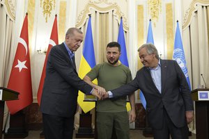 Ukrainian President Volodymyr Zelenskyy, center, Turkish President Recep Tayyip Erdogan, left, and United Nations Secretary General Antonio Guterres shake hands after their meeting in Lviv, Ukraine, Thursday, Aug. 18, 2022