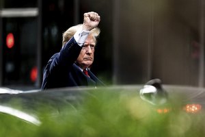 Former President Donald Trump gestures as he departs Trump Tower, Wednesday, Aug. 10, 2022, in New York, on his way to the New York attorney general's office for a deposition in a civil investigation