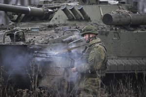 A Russian army soldier takes part in drills at the Kadamovskiy firing range in the Rostov region in southern Russia, Friday, Dec. 10, 2021