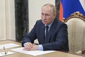 Russian President Vladimir Putin attends a meeting via teleconference call, in Moscow, Russia, Monday, Aug. 22, 2022