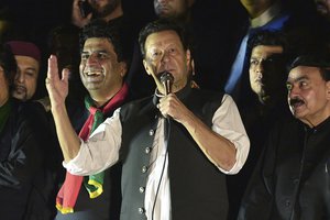 Pakistan's former Prime Minister Imran Khan, center, addresses during an anti-government rally in Islamabad, Pakistan, Saturday, Aug. 20, 2022.