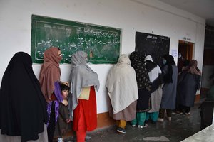 Voters stand in a queue for voting District Development Council(DDC) election in Kashmir valley,India, 04 December 2020.