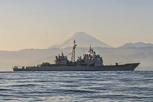 Ticonderoga-class guided-missile cruiser USS Antietam (CG 54) is underway off the coast of Japan near Mt. Fuji.