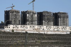 Construction is underway at the West Bank Israeli settlement of Givat Ze'ev, Wednesday, Aug. 24, 2022.