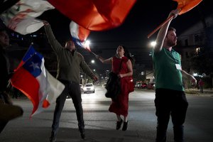 Opponents of the new Constitution cheer in the streets the results of a plebiscite on whether the new Constitution will replace the current Magna Carta imposed by a military dictatorship 41 years ago, in Santiago, Chile, Sunday, Sept. 4, 2022.