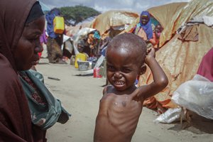 Nurto Mohamud Ali, 45, who fled the drought-stricken Lower Shabelle region, sits next to her malnourished son Mohamud Hussein, 2, at a camp for the displaced on the outskirts of Mogadishu, Somalia on Sept. 3, 2022. Rich countries say they will spend about $25 billion by 2025 to boost Africa’s efforts to adapt to climate change as the continent continues to struggle with drought, cyclones and extreme heat, according to officials at a summit in Rotterdam in the Netherlands.