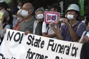 People protest outside Diet against the state paying for former Prime Minister Shinzo Abe's funeral, Wednesday, Aug. 31, 2022, in Tokyo.