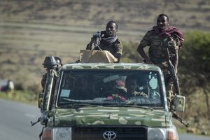 In this Saturday, May 8, 2021 file photo, Ethiopian government soldiers ride in the back of a truck on a road near Agula, north of Mekele, in the Tigray region of northern Ethiopia