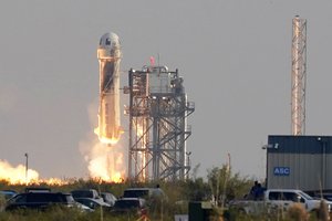 Blue Origin's New Shepard rocket launches carrying passengers Jeff Bezos, founder of Amazon and space tourism company Blue Origin, brother Mark Bezos, Oliver Daemen and Wally Funk, from its spaceport near Van Horn, Texas on July 20, 2021