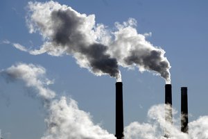 Steam is emitted from smoke stacks at a coal-fired power plant Nov. 17, 2021, in Craig