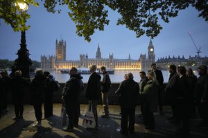 People queue to pay their respect to the late Queen Elizabeth II during the Lying-in State, at Westminster Hall in London, Thursday, Sept. 15, 2022. The Queen will lie in state in Westminster Hall for four full days before her funeral on Monday Sept. 19.