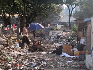 People living in poverty inside a local cemetery in Manila, Philippines.