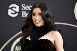 Cardi B poses for photos after the ceremonial red carpet roll out at the 2021 American Music Awards on Friday, Nov. 19, 2021, in Los Angeles