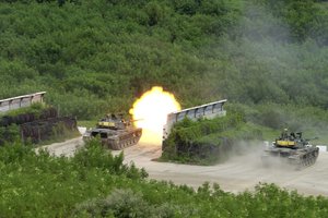 A Taiwanese tank fires at targets during a military exercise in Hengchun, Pingtung county in southern Taiwan on Wednesday, Sept. 7, 2022