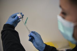 FILE - In this April 3, 2021, file photo, a health worker prepares a dose of the AstraZeneca vaccine during a COVID-19 vaccination campaign in Pamplona, northern Spain.