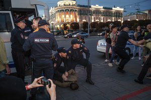 Police detain demonstrators during a protest against mobilization in Yekaterinburg, Russia, Wednesday, Sept. 21, 2022