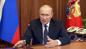 In this image taken from video released by the Russian Presidential Press Service, Russian President Vladimir Putin gestures as he addresses the nation in Moscow, Russia, Sept. 21, 2022.