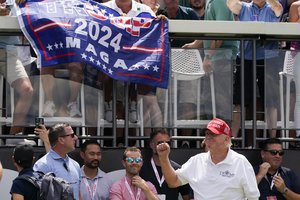 Donald Trump greets fans at the first tee during the final round of the Bedminster Invitational LIV Golf tournament in Bedminster, N.J., Sunday, July 31, 2022