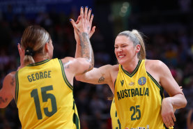 Lauren Jackson (right) and Cayla George celebrate the Opals’ key win.